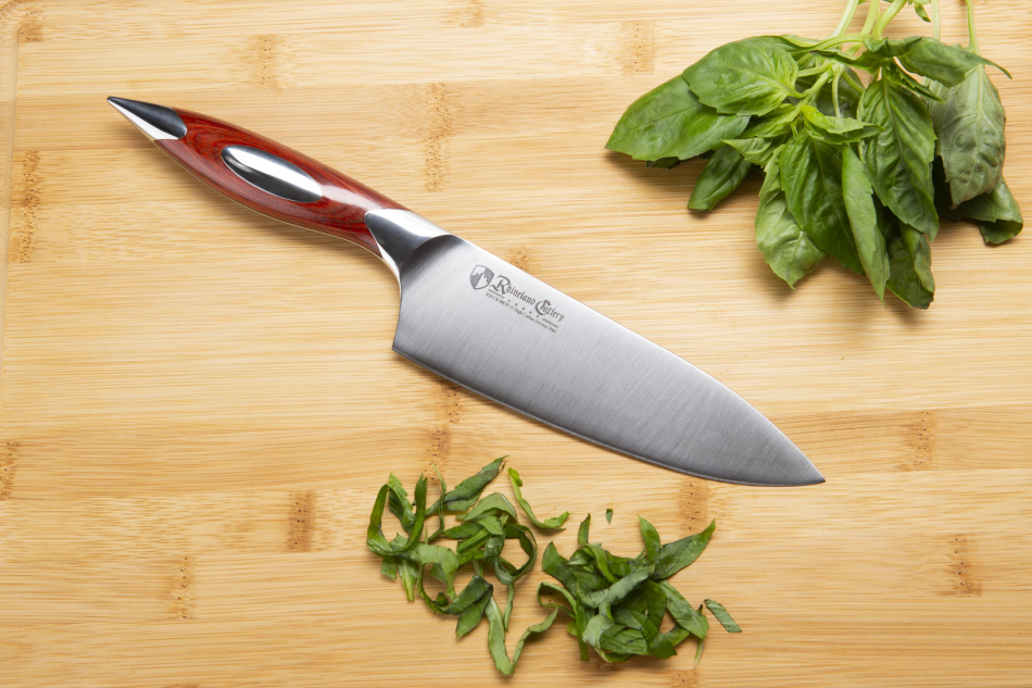 Rhineland Chef knife cutting basil